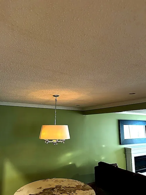 HEPA dust-controlled popcorn ceiling removal in a kitchen