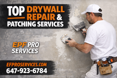Drywall repair and patching services image showing a taper finishing a damaged wall patch