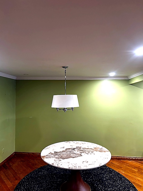 Bright room with smooth ceiling after painted popcorn removal